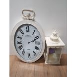 A CANDLE LANTERN TOGETHER WITH PARIS TIN METAL OVAL SHAPED WALL HANGING CLOCK