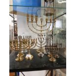 A LOT OF BRASS AND SILVER PLATED MENORAHS