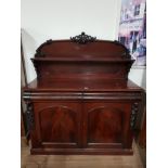 REPRODUCTION MAHOGANY SIDEBOARD WITH SCROLL TOP AND HEAVILY CARVED SIDES