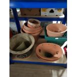 A LARGE LOT OF POTS AND PLANTERS