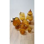 A COLLECTION OF AMBER GLASS INCLUDING CAT AND MOUSE BRANDY GLASSES