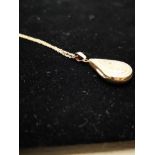 9CT GOLD FINE CHAIN AND 9CT GOLD PEAR SHAPED LOCKET