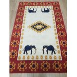 LARGE INDIAN RUG WITH ELEPHANT DESIGN 239CM X 151CM