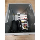 A BOX CONTAINING A PSP AND ASSORTED GAMES