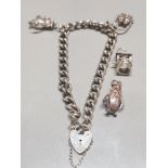 HALLMARKED SILVER CHARM BRACELET WITH PADLOCK AND 4 CHARMS 22.4G