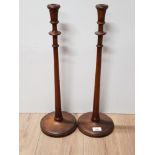PAIR OF 21 INCH TURNED ELM OR FRUIT WOOD CANDLESTICKS