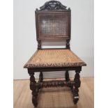 HEAVILY CARVED OAK EDWARDIAN HALL CHAIR WITH A BERGERE BACK AND SEAT