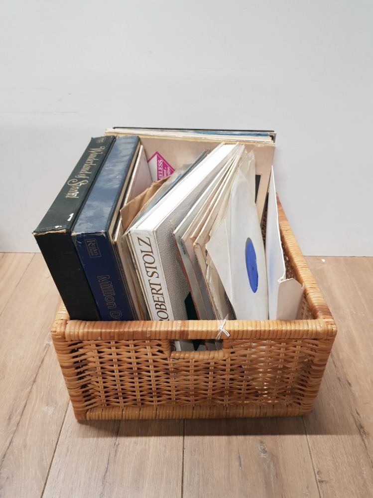 A WICKER BASKET CONTAINING ASSORTED LP RECORDS