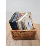 A WICKER BASKET CONTAINING ASSORTED LP RECORDS