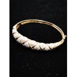 9CT GOLD ORNATE DIAMOND BANGLE 13.8G