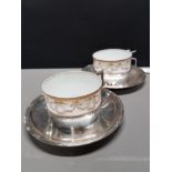 2 LIMOGES CUPS ON SILVER PLATED BASES AND WITH SAUCERS