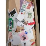 BOX CONTAINING A LARGE QUANTITY OF STAMPS FROM AROUND THE WORLD