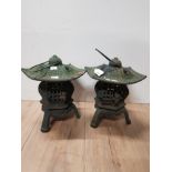 A PAIR OF CAST IRON ORIENTAL PATIO LANTERNS