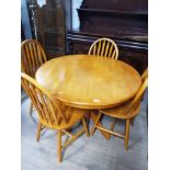 CIRCULAR TOPPED BEECH DINING TABLE AND 4 WINDSOR BACK CHAIRS