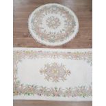 2 FRINGED CREAM FLORAL PATTERNED CHINESE STYLE RUGS