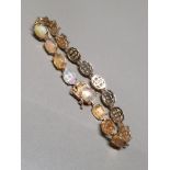 9CT YELLOW GOLD OPAL AND YELLOW STONE BRACELET 13G GROSS WEIGHT