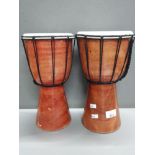 PAIR OF REPRODUCTION BUCARA DJEMBE HAND DRUMS
