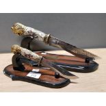 2 MOUNTED ORIENTAL STYLE DAGGERS WITH LION HANDLES