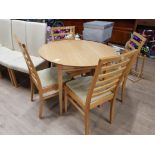 A NICE MODERN SOLID OAK CIRCULAR TIOPED TABLE WITH 4 MATCHING CHAIRS