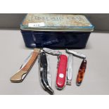 VINTAGE FIRST AID TIN CONTAINING 7 POCKET KNIVES SWISS AND LE MONT SAINT MICHEL ET