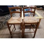 A PAIR OF OAK RUSH SEATED KITCHEN BARSTOOLS