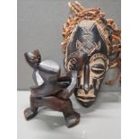 AFRICAN CHOKWE MASK AND A DARK WOOD BOWL STAND CARVED FROM A SINGLE PIECE OF WOOD AND REPRESENTING 3