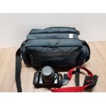 A CAMERA BAG CONTAINING CANON EOS 1000F CAMERA