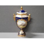 BEAUTIFUL LIDDED HAND PAINTED COALPORT URN VASE WITH LAVISH GILDED TWIN HANDLES MODELLED AS RAMS
