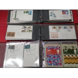 2 ALBUMS CONTAINING A COLLECTION OF 100 BRITISH FIRST DAY COVERS DATES RANGING FROM 1966-1980 ALSO