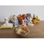 8 CABINET PIECES TO INCLUDE HUMMEL AND 3 PIN CUSHION LADIES ONE BEING A RARE FLAPPER