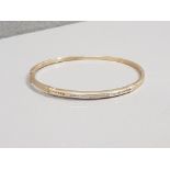 9CT GOLD DIAMOND BANGLE APX .25CT 9.3G