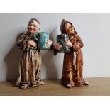 2 POSSIBLY WEST GERMAN FRIAR FIGURINES COULD BE FOR ADVERTISING A GERMAN BREWERY INITIALLED KB ONE