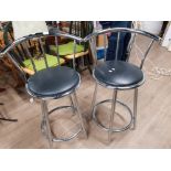 A PAIR OF CHROME BREAKFAST STOOLS