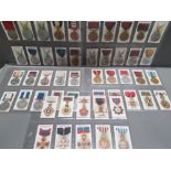 COMPLETE SET OF 50 1912 TADDYS CIGARETTE CARDS BRITISH MEDALS AND DECORATIONS IN GOOD CONDITION WITH