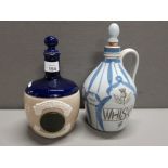 BUCHAN STONEWARE WHISKEY FLAGON TOGETHER WITH A WILLIAM WHITELEY FLAGON