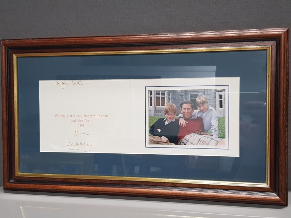 CHRISTMAS CARD OF 1994 FROM PRINCE CHARLES SIGNED BY HIM, CARD BEARS A PHOTOGRAPH OF HIM WITH HIS