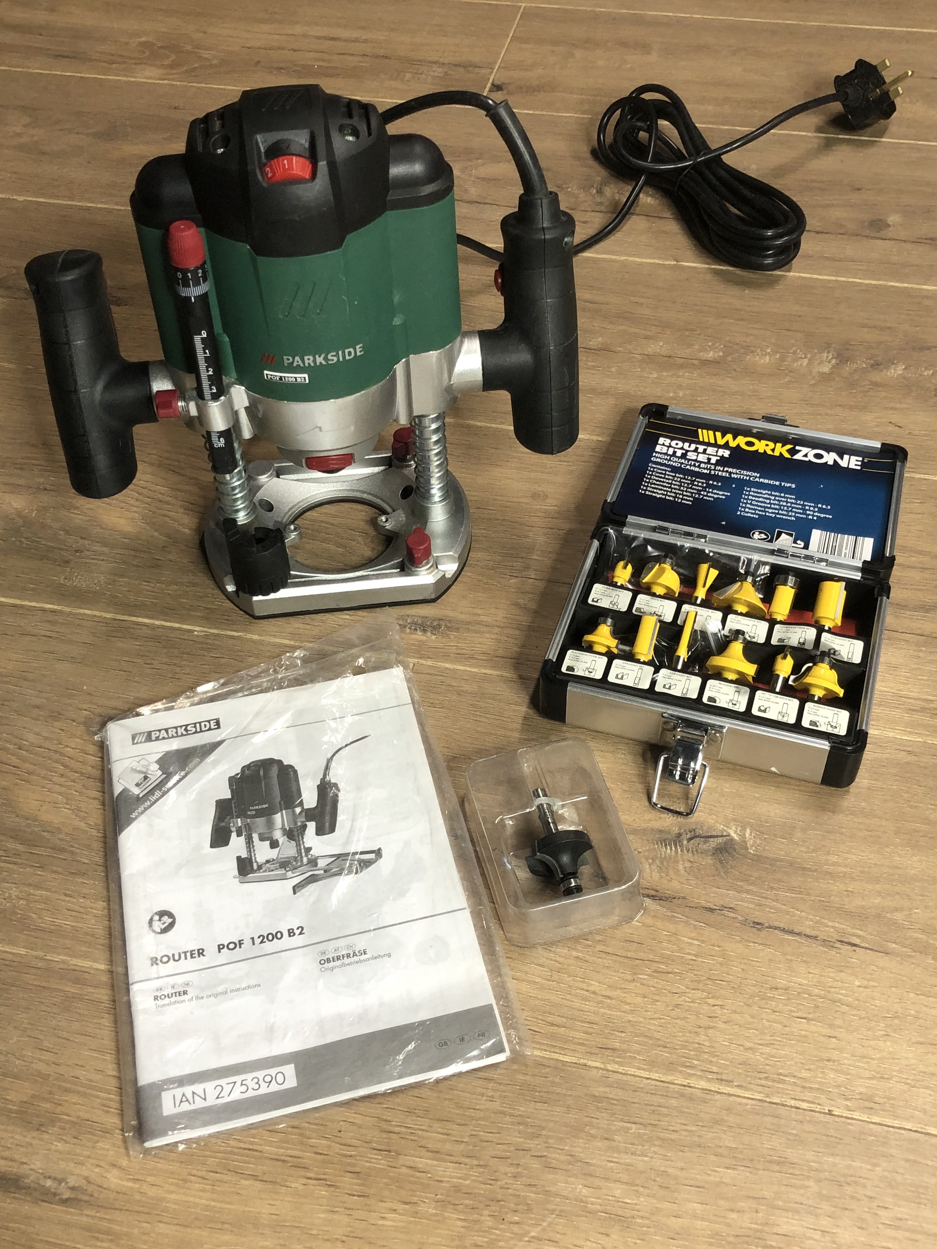 A PARKSIDE ROUTER TOGETHER WITH COMPLETE WORKZONE ROUTER BIT SET