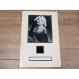 MARILYN MONROE CUT PIECE OF A BLACK EVENING DRESS WORN BY HER ACCOMPANIED BY A LETTER OF
