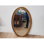 GILT FRAMED OVAL SHAPED BEVELLED EDGED MIRROR