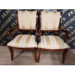 A PAIR OF REPRODUCTION MAHOGANY FRENCH EMPIRE CARVER CHAIRS UPHOLSTERED IN GOLD AND GRECIAN SILK