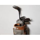 VINTAGE GOLF BAG CONTAINING CLUBS DRIVER, PUTTER AND IRONS
