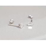 WHITE GOLD EMERALD CUT DIAMOND STUDS