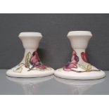 A PAIR OF BEAUTIFUL MOORECROFT MAGNOLIA CANDLESTICKS 9CM