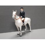 A BESWICK HUNTSWOMAN HORSE FIGURINE DESIGNED BY ARTHUR GREDINGTON MODEL NO.1730