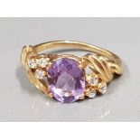 18CT YELLOW GOLD PURPLE OVAL STONE AND DIAMOND RING 4.1G SIZE H