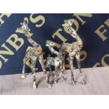 A FAMILY OF 3 COLLAGE GIRAFFE ORNAMENTS DECORATED WITH MULTI ANIMAL SKIN INC LION ZEBRA LEOPARD