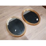 PAIR OF OVAL GOLD MIRRORS