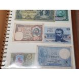 ALBUM CONTAINING OVER 200 BANKNOTES FROM AROUND THE WORLD IN MIXED CIRCULATED GRADES