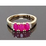 3 STONE RUBY AND SILVER RING