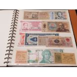 ALBUM CONTAINING OVER 200 BANKNOTES FROM AROUND THE WORLD IN MIXED CIRCULATED GRADES